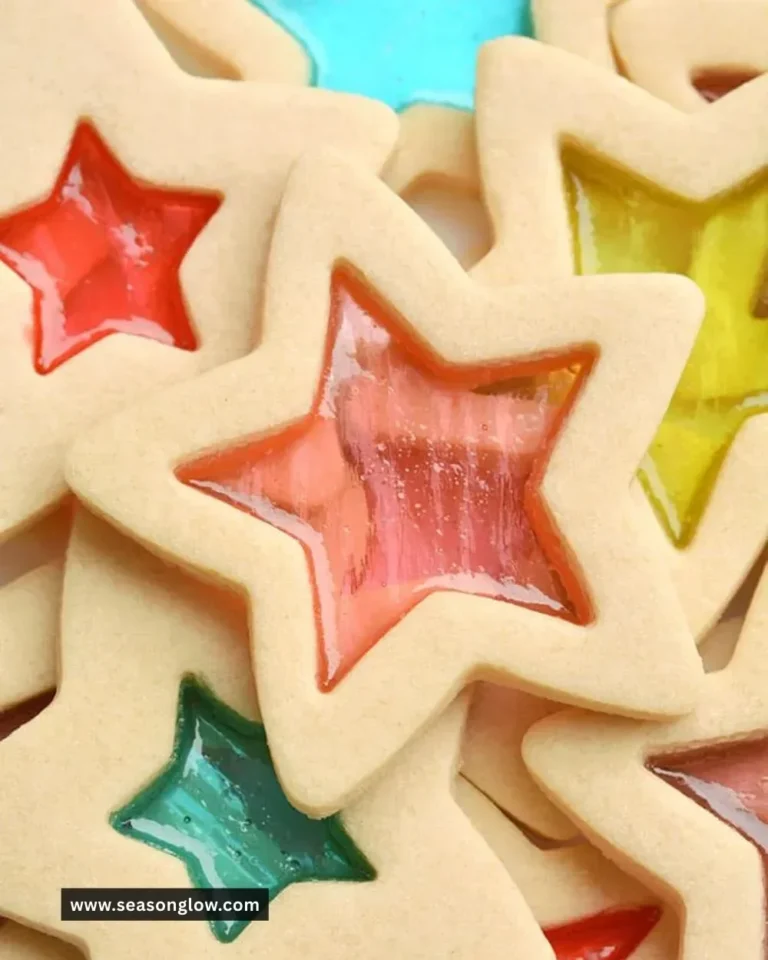 Colorful stained glass cookies shaped like festive designs.