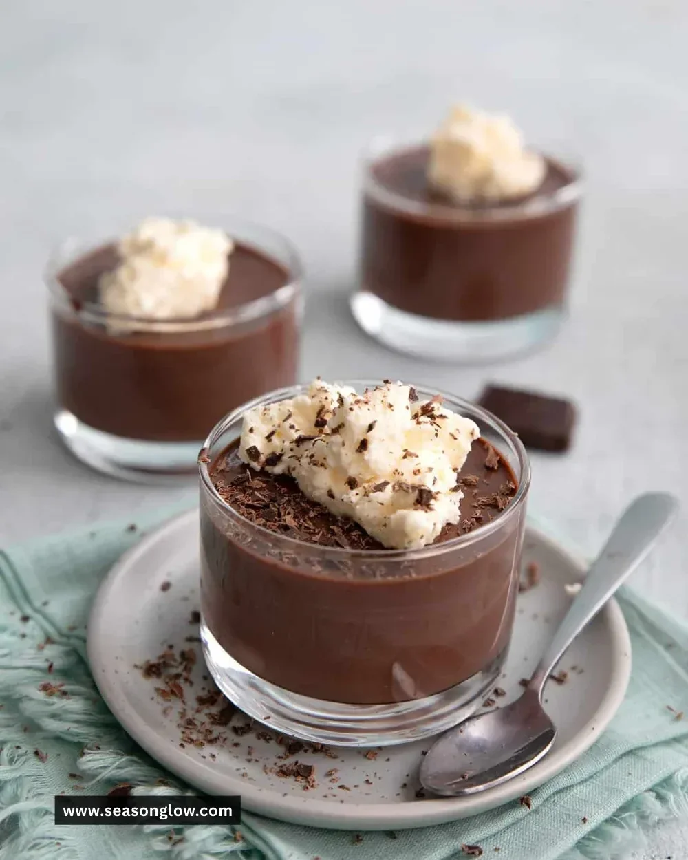 Bowl of homemade sugar-free chocolate pudding topped with whipped cream