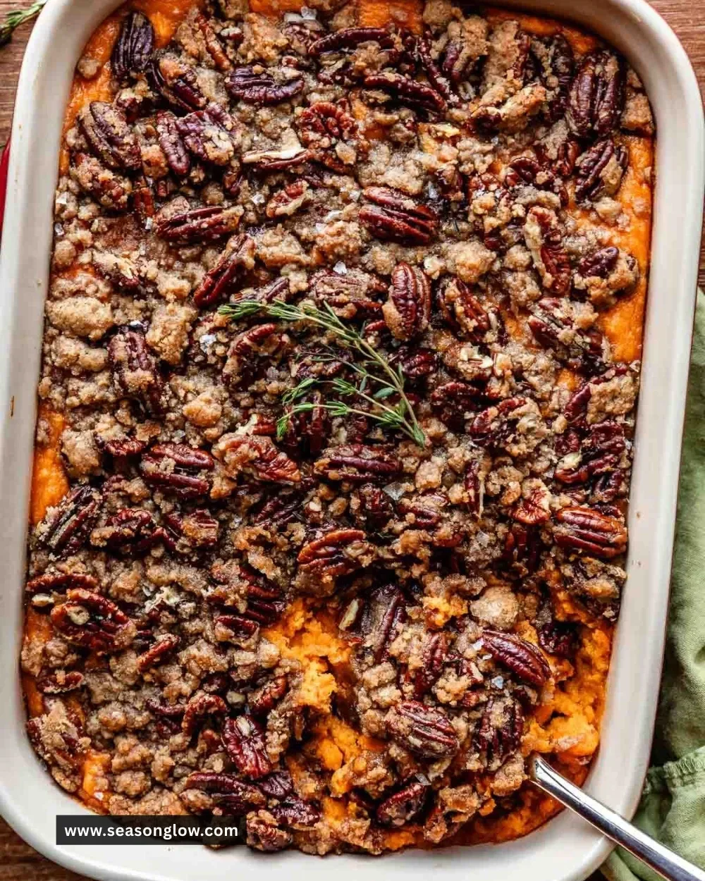 Delicious sweet potato casserole topped with marshmallows and pecans