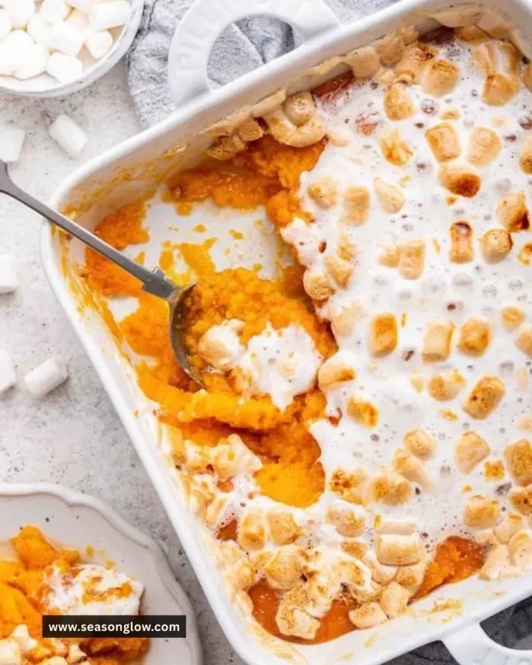 Delicious sweet potato casserole topped with marshmallows ready for serving