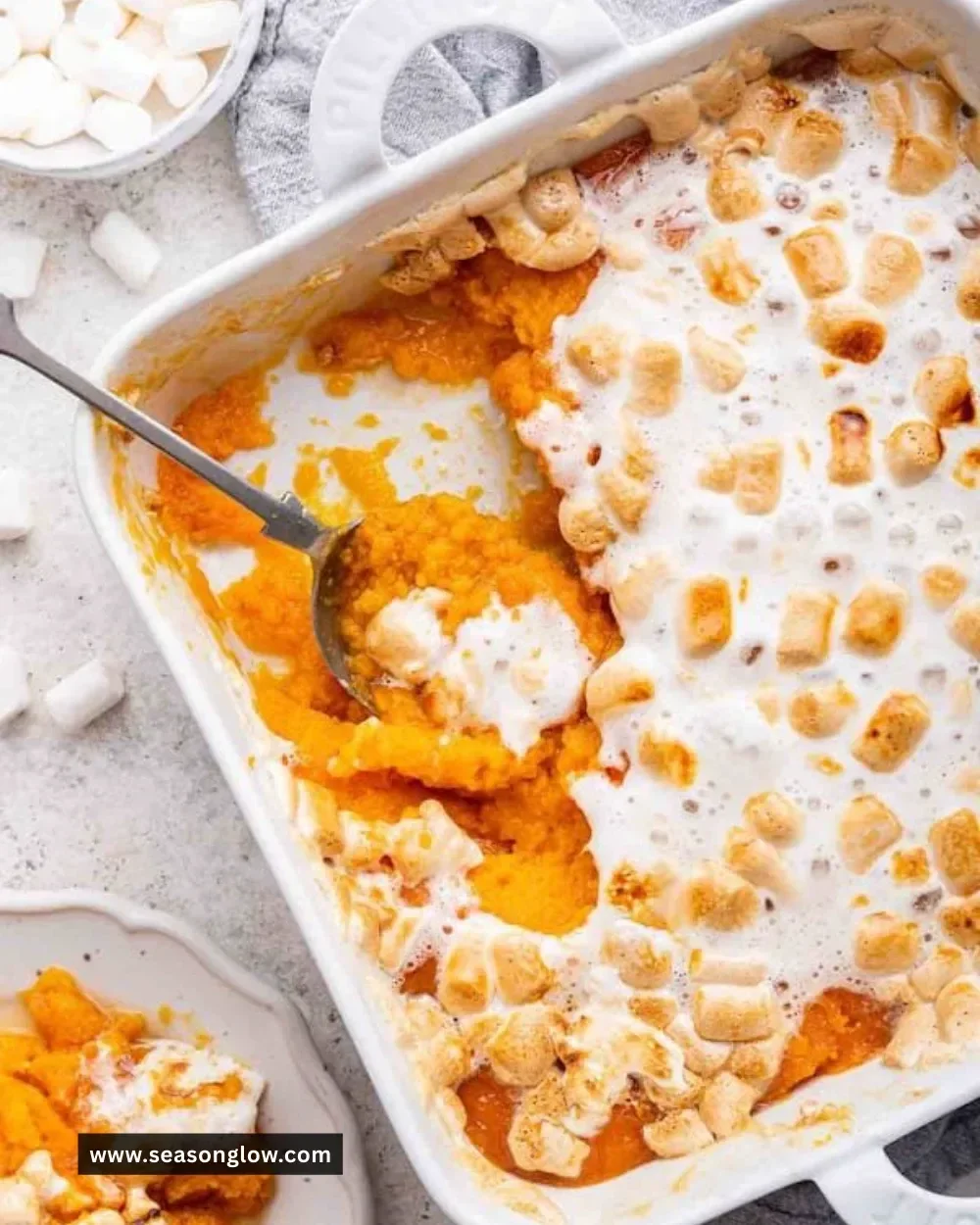 Delicious sweet potato casserole topped with marshmallows ready for serving