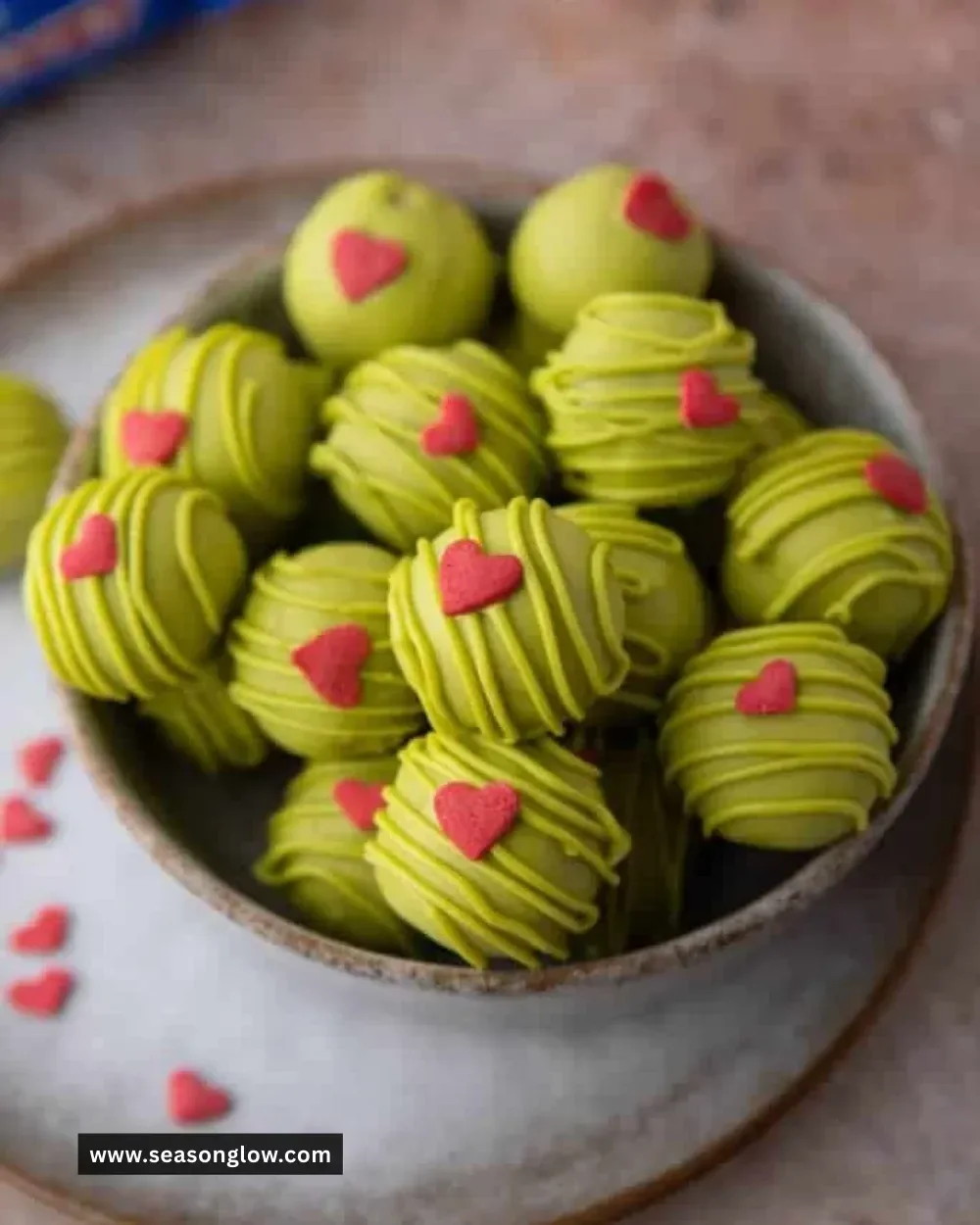 Delicious no-bake Grinch Oreo Truffles decorated for the holidays