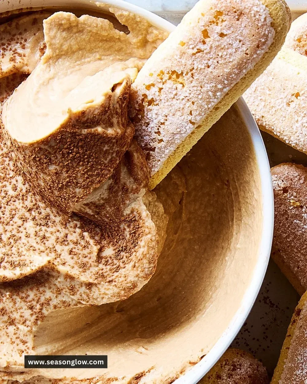 Delicious tiramisu dip served in a bowl with chocolate garnish
