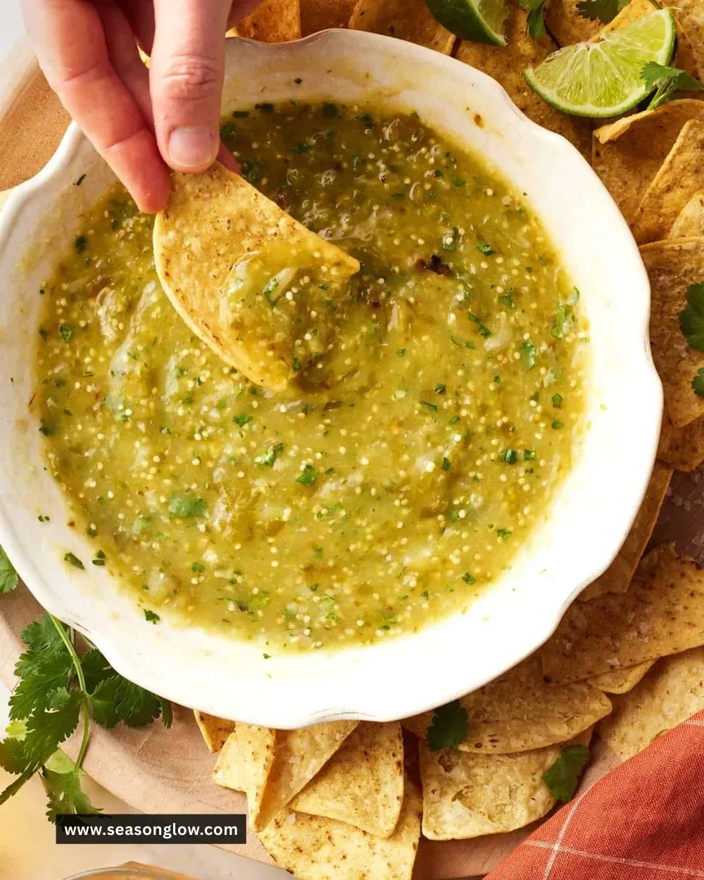 Homemade tomatillo green sauce served with chips and tacos