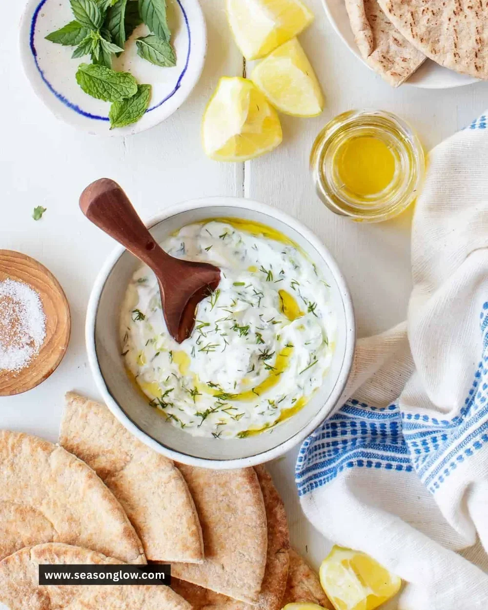 Delicious tzatziki dip served with pita bread and fresh vegetables