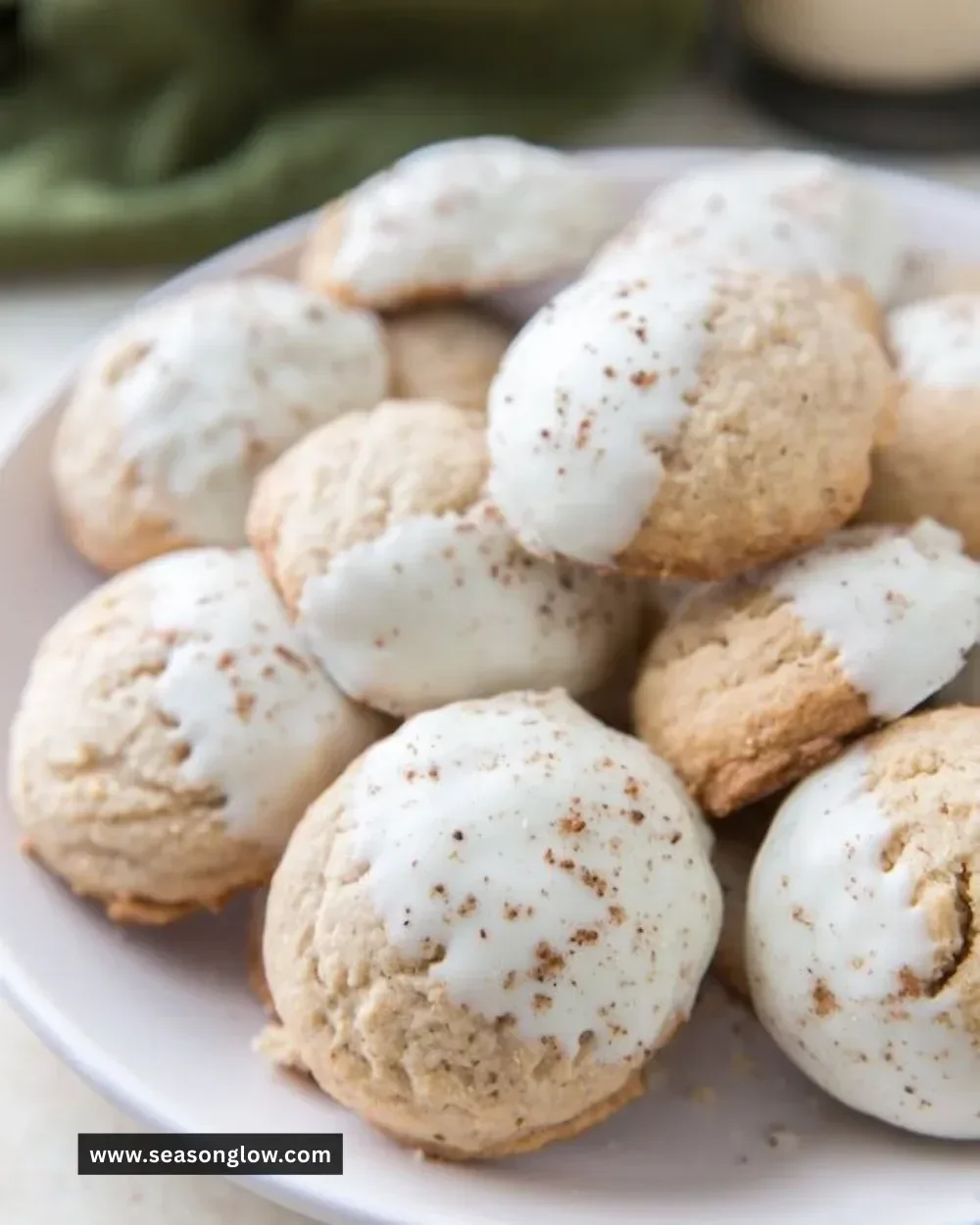 Delicious white chocolate dipped eggnog cookies decorated for the holidays