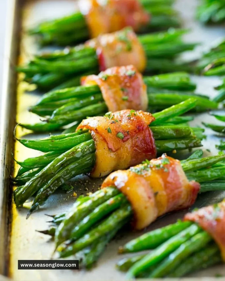 Bacon wrapped green beans on a rustic plate, garnished and ready to serve.
