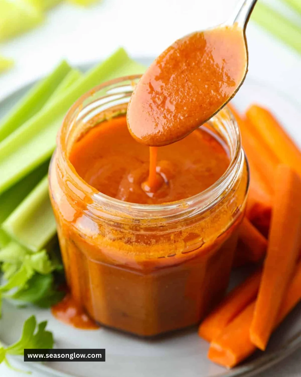Buffalo sauce drizzled over chicken wings