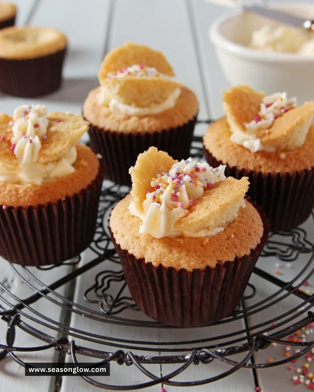 Colorful butterfly cakes decorated with icing and edible flowers