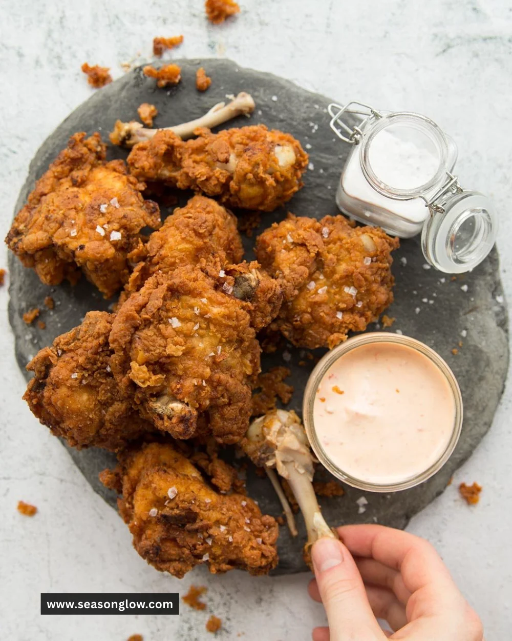 Crispy and juicy buttermilk fried chicken served on a rustic wooden table