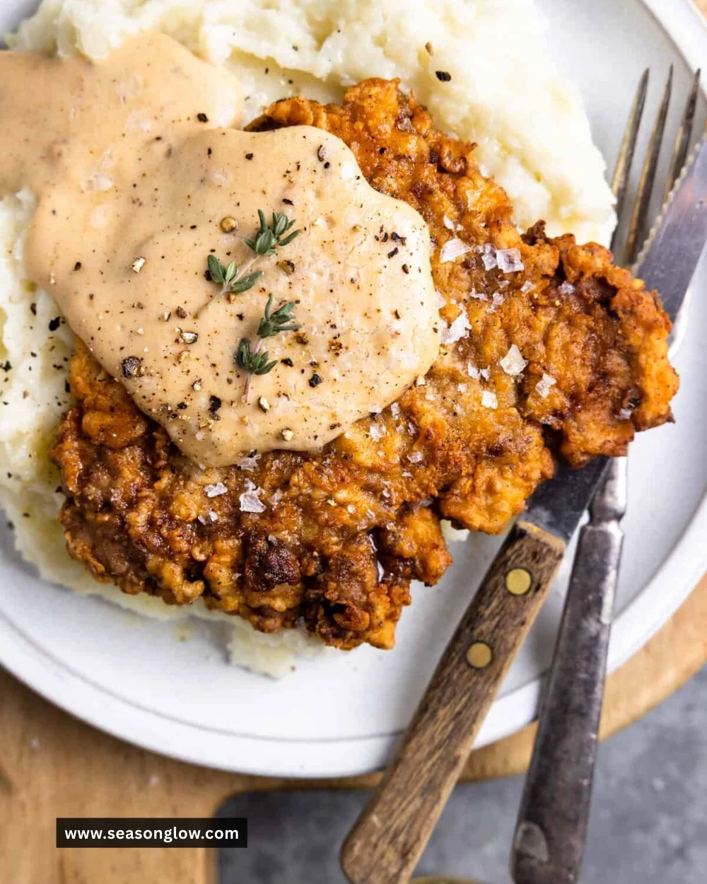 Delicious chicken fried steak served with gravy and sides