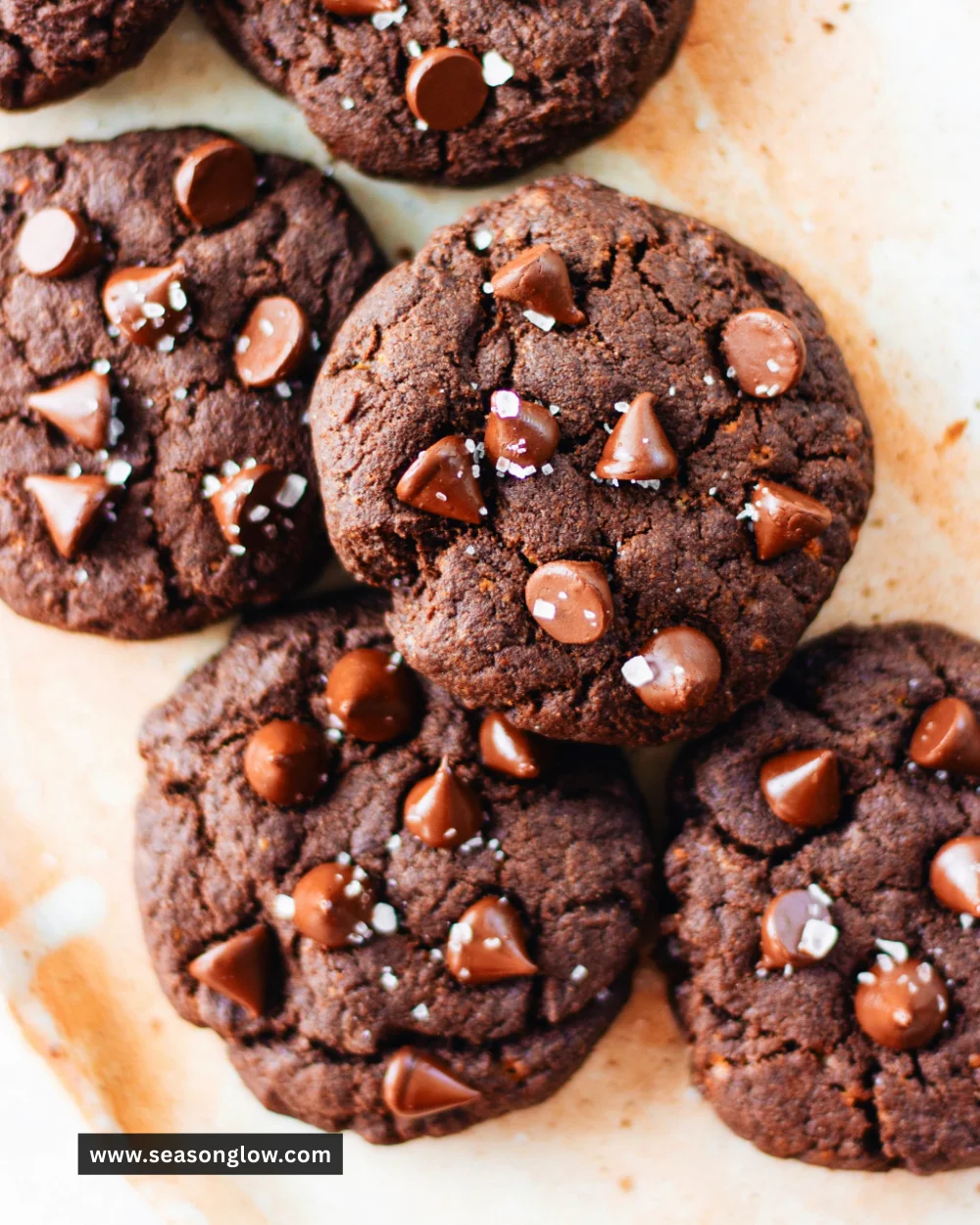 Freshly baked chocolate chip cookies on a baking sheet