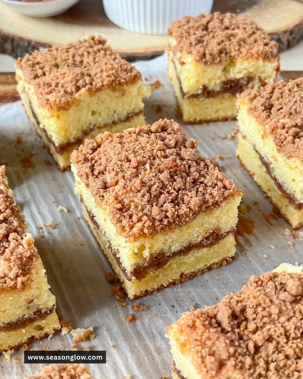 A slice of homemade cinnamon coffee cake on a plate, showcasing its moist texture.