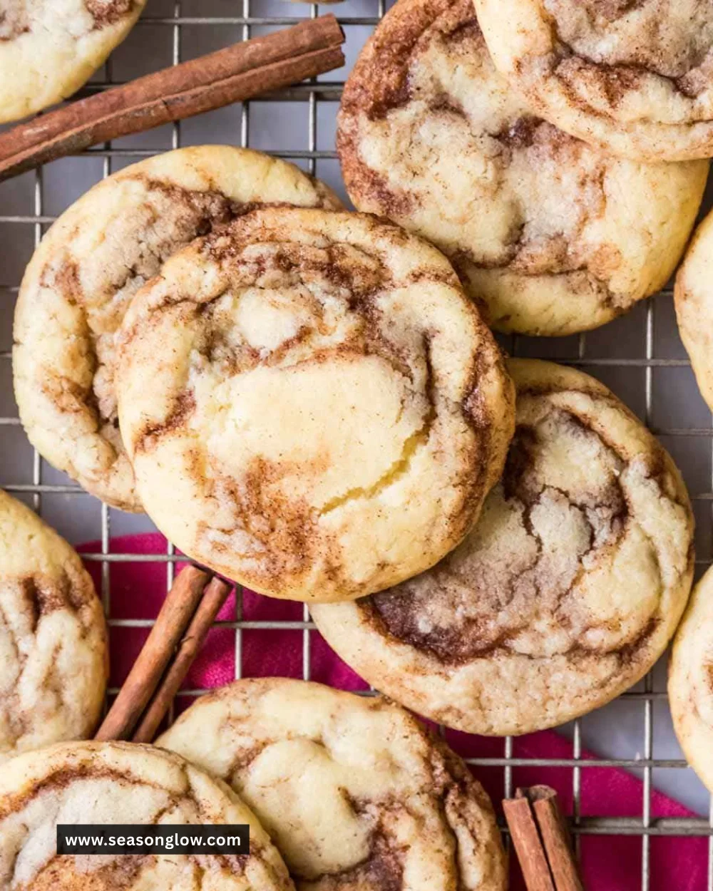 Freshly baked cinnamon cookies on a cooling rack