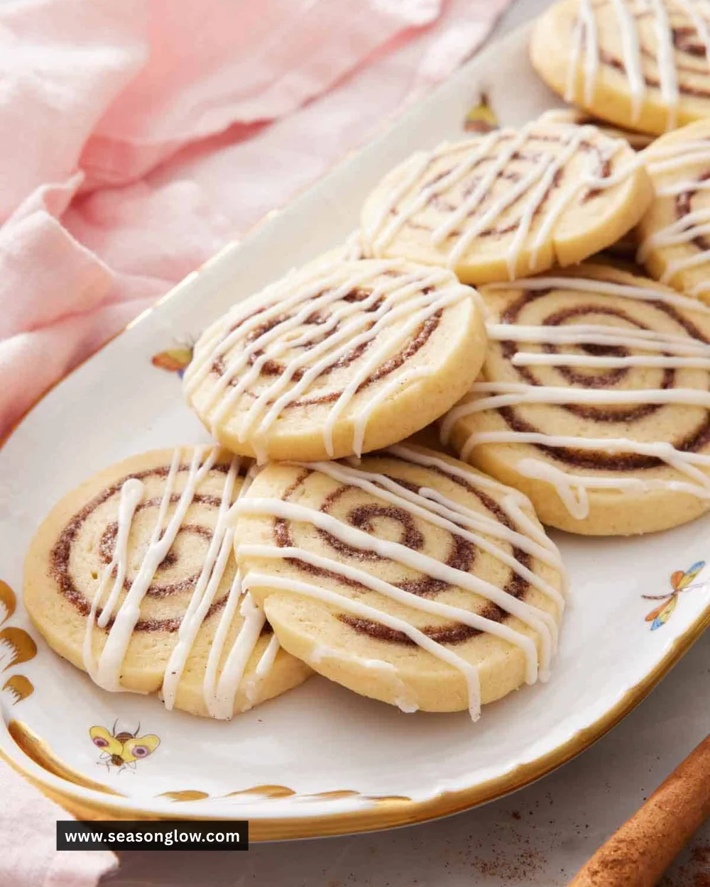 Freshly baked cinnamon roll cookies on a cooling rack