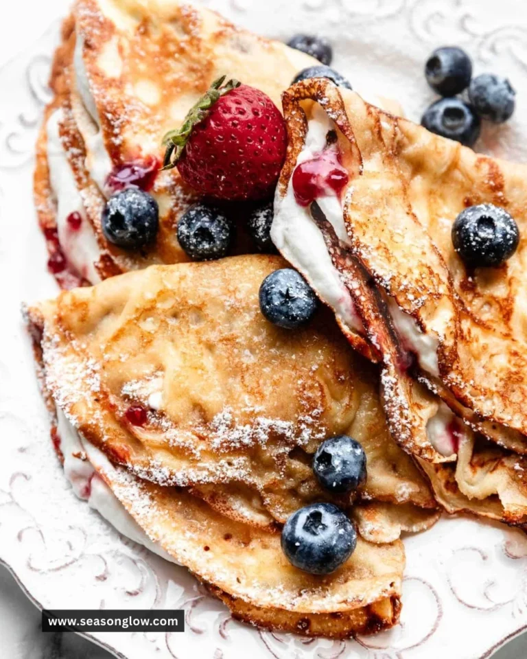 Delicious crepes with various fillings and toppings served on a plate