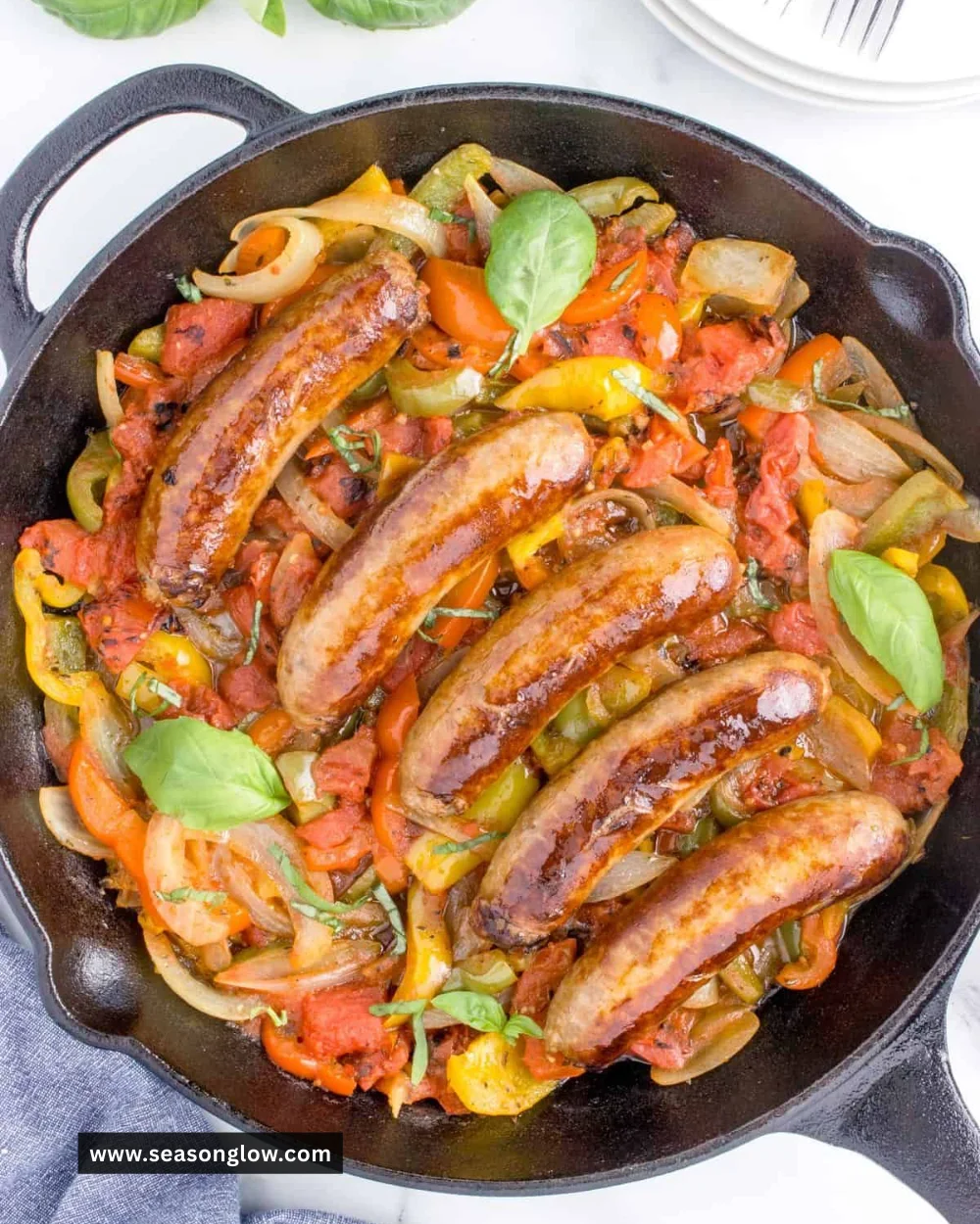 Plate of Italian sausage and peppers served in a colorful dish