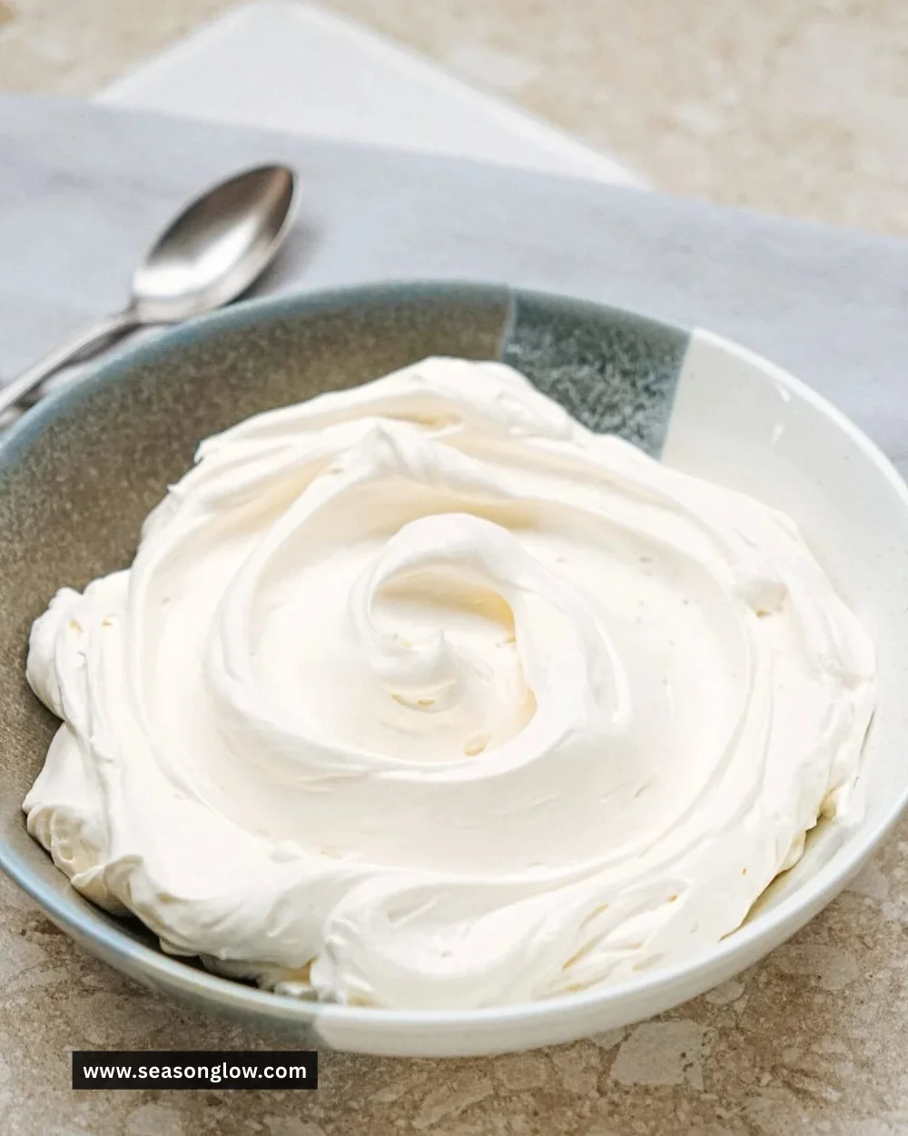 Creamy no-bake cheesecake filling in a mixing bowl