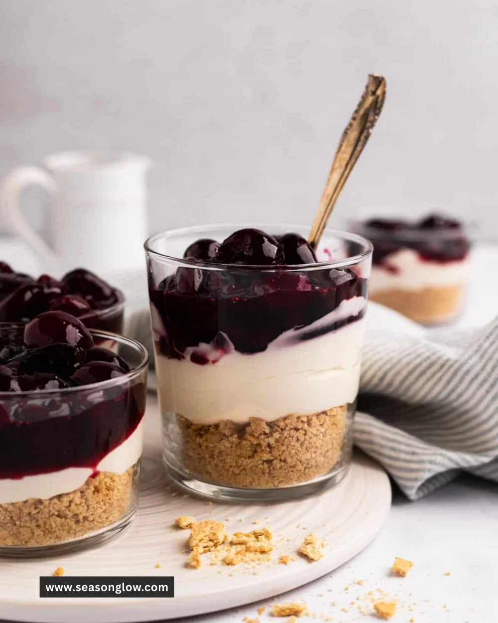 No-Bake Cherry Cheesecake topped with fresh cherries and whipped cream