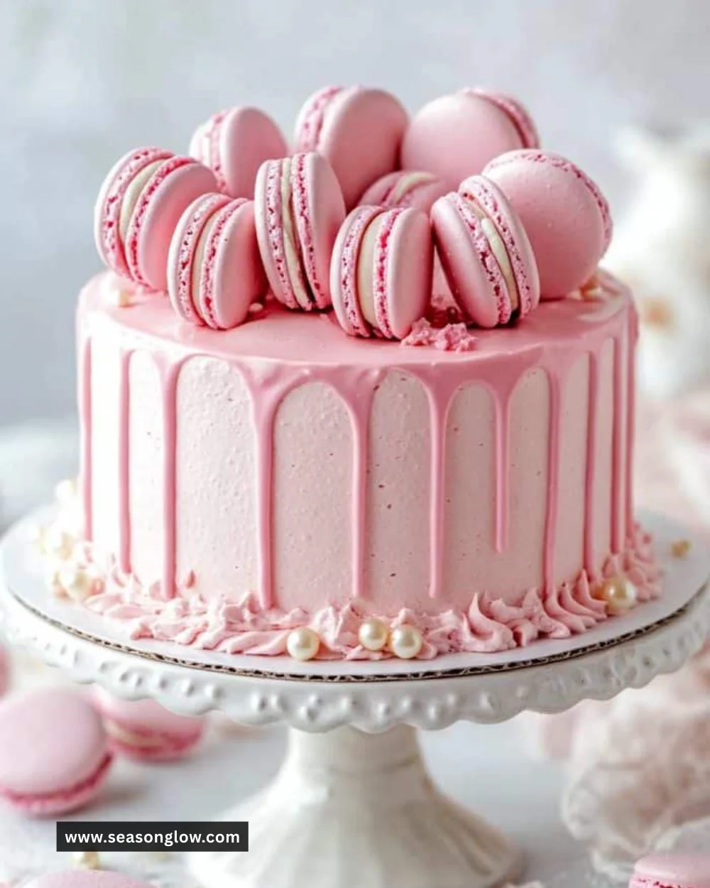 Delicious pink cake topped with creamy frosting and decorative sprinkles