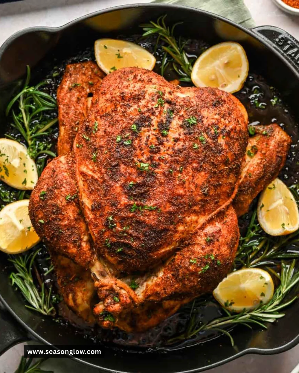 Delicious rotisserie chicken served with sides and herbs