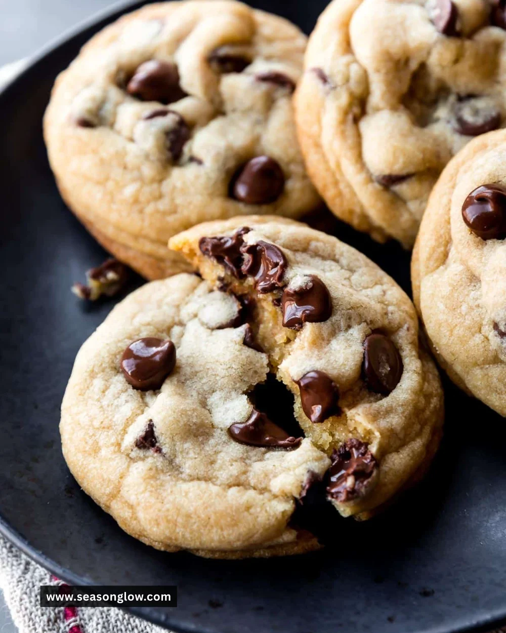 Freshly baked soft chocolate chip cookies on a cooling rack