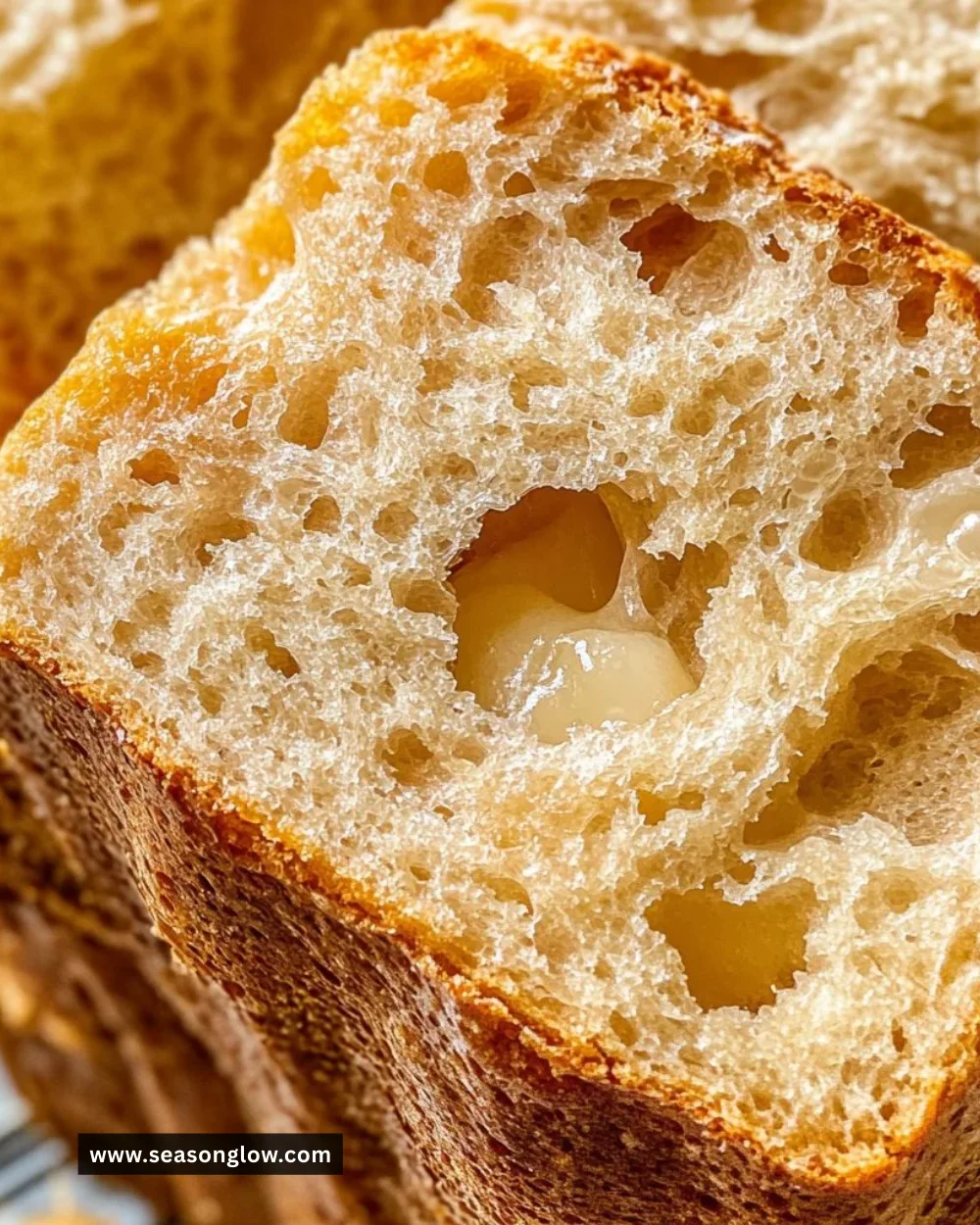 Freshly baked beef broth bread loaf on a wooden table