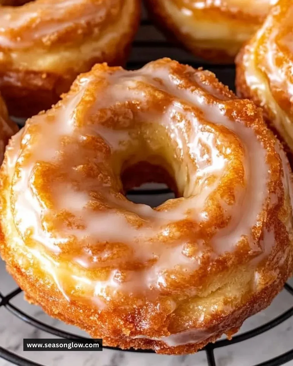 Delicious French Crullers topped with glaze, perfect for a sweet treat.