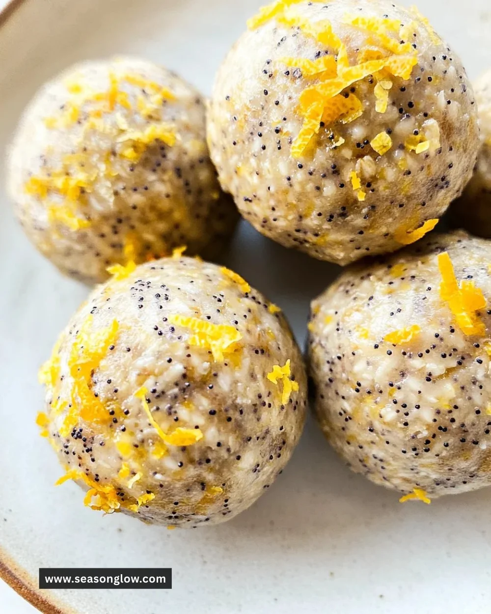 No-bake lemon poppyseed protein balls on a wooden table