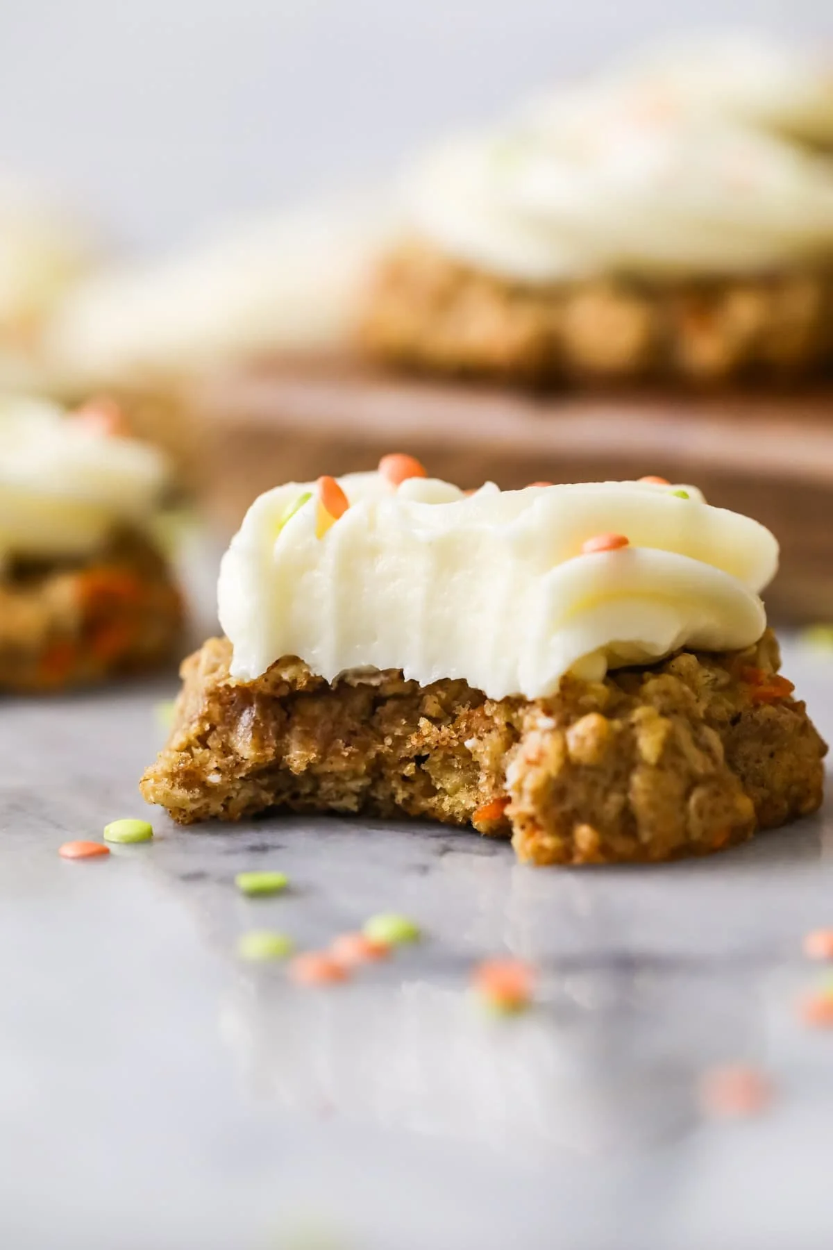 Freshly baked carrot cake cookies on a cooling rack