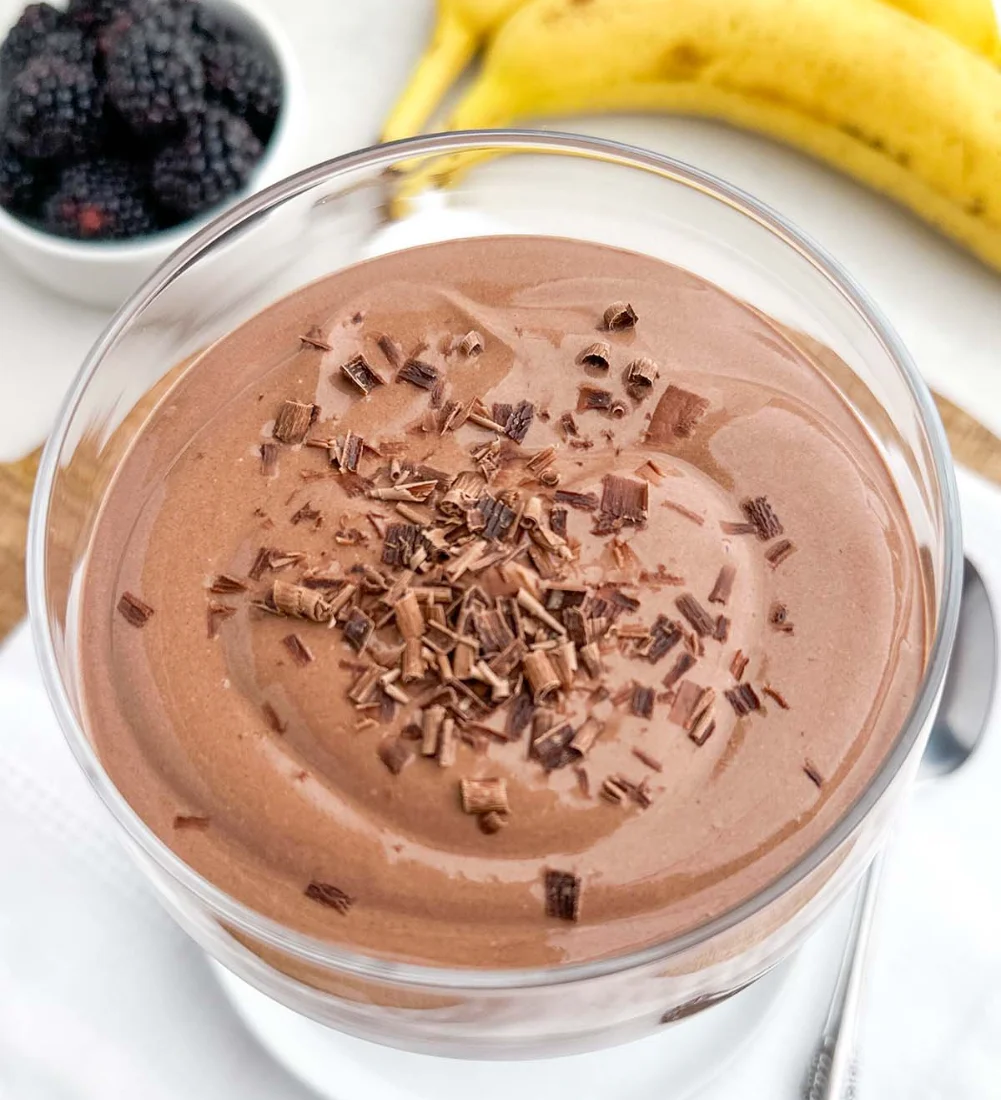 Delicious Chocolate Greek Yogurt in a bowl topped with fresh berries.