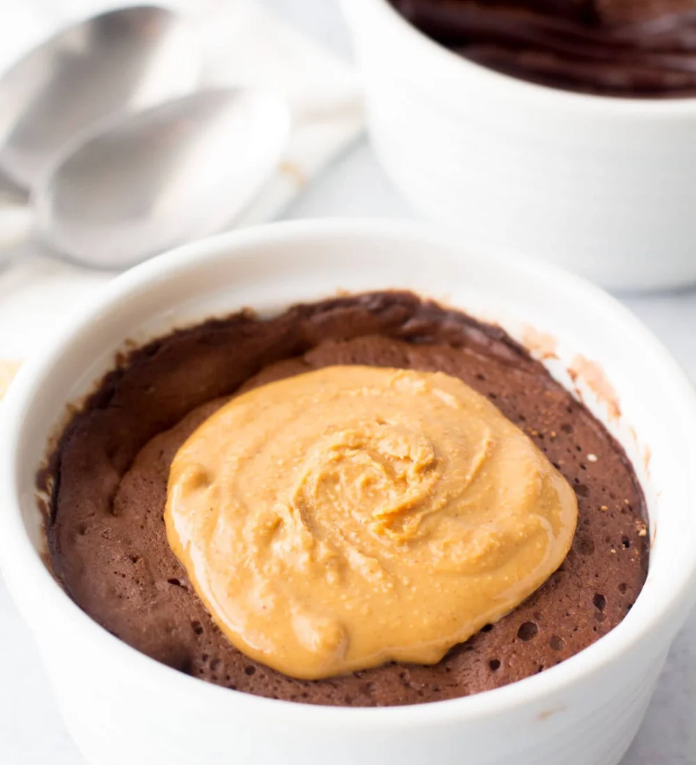 Delicious Chocolate Peanut Butter Protein Mug Cake served in a mug