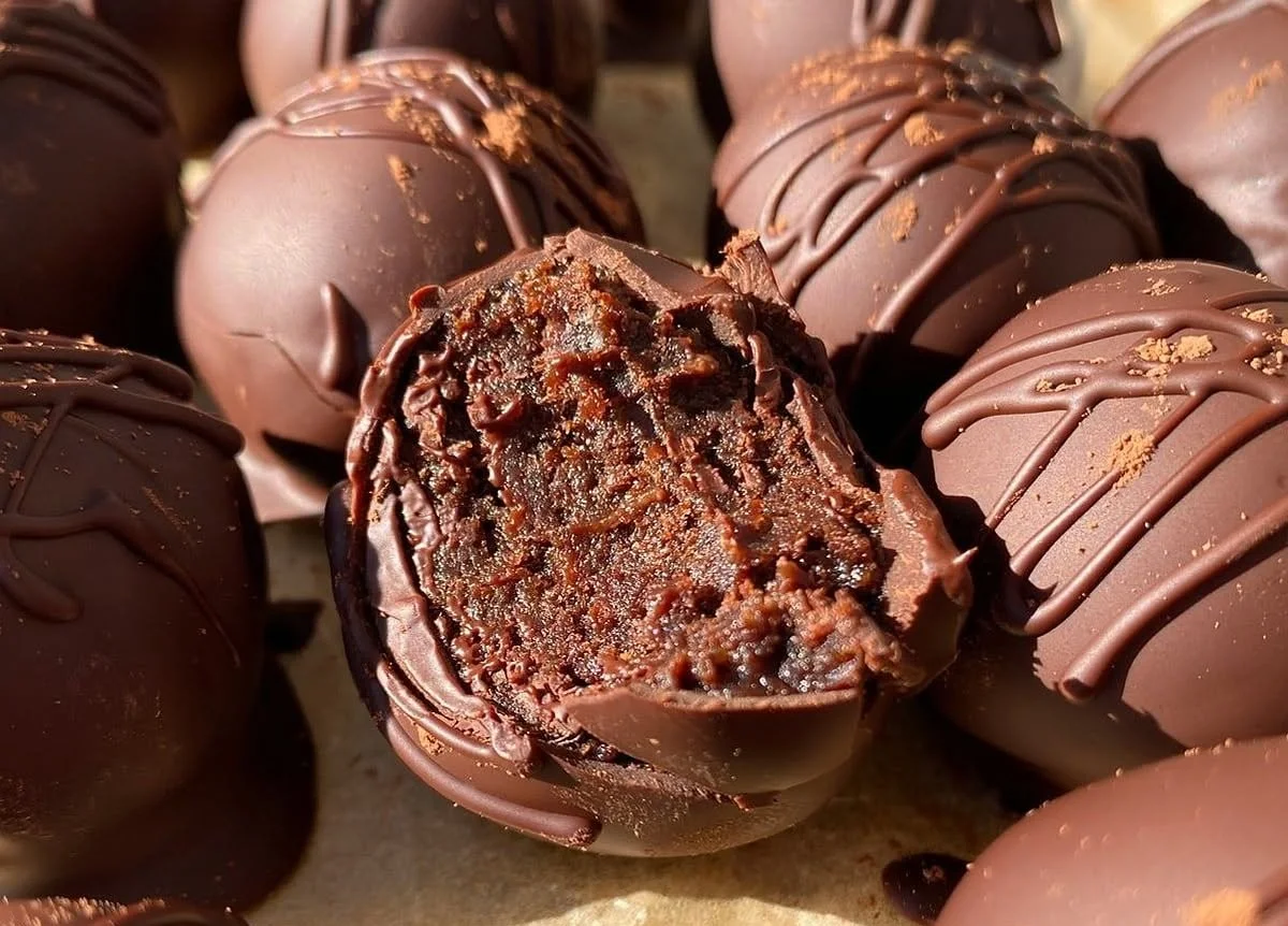Delicious protein brownie bites on a plate, ideal for a healthy snack.