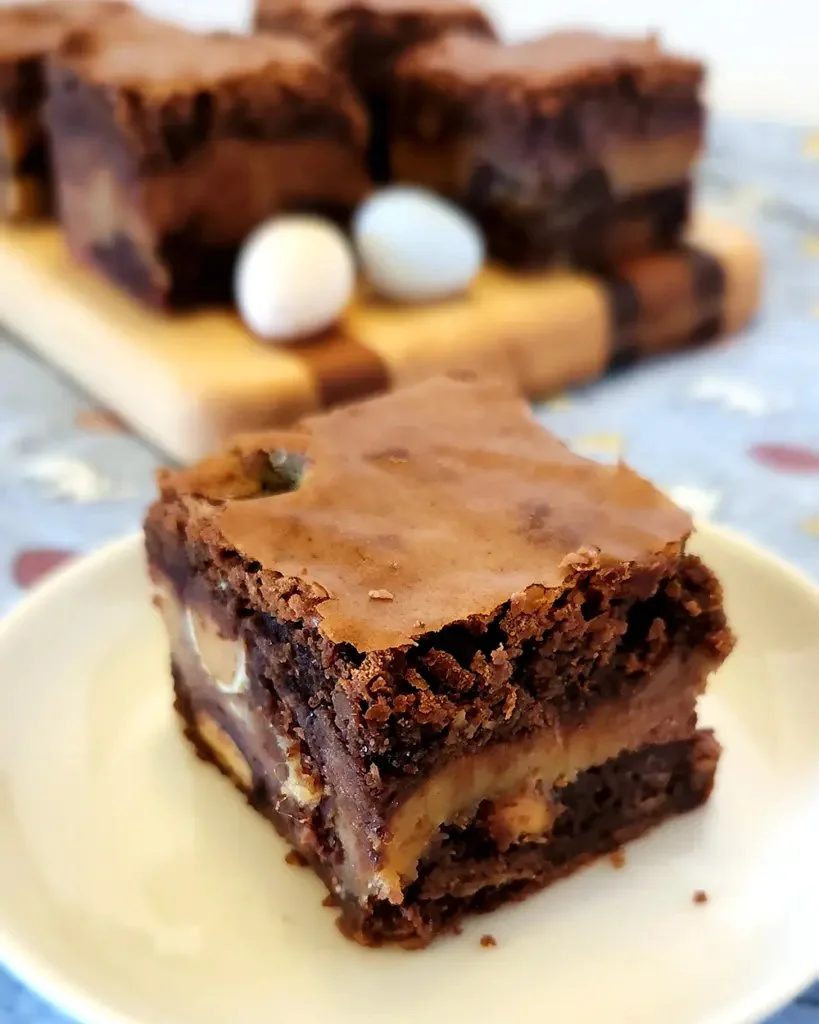Decadent Easter Candy Brownies topped with colorful holiday candies.