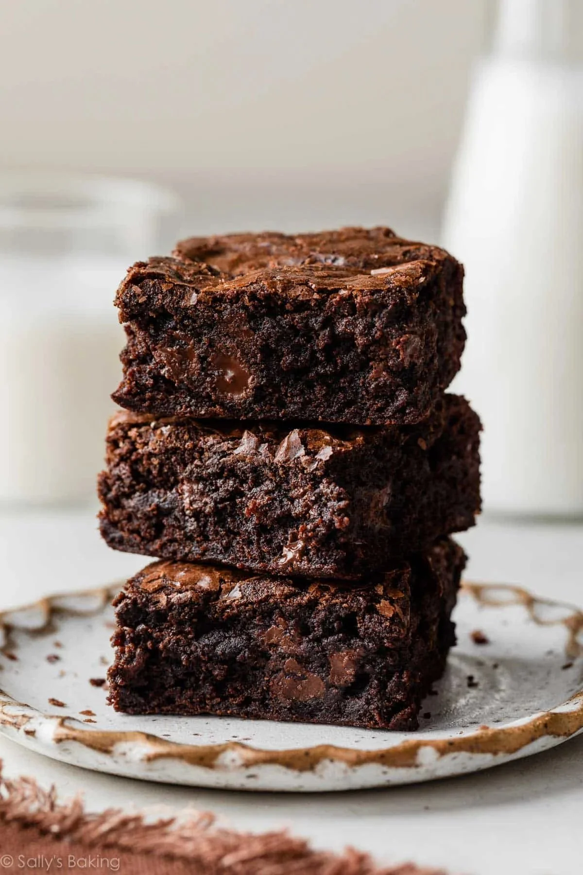 Delicious fudgy homemade brownies on a rustic wooden table