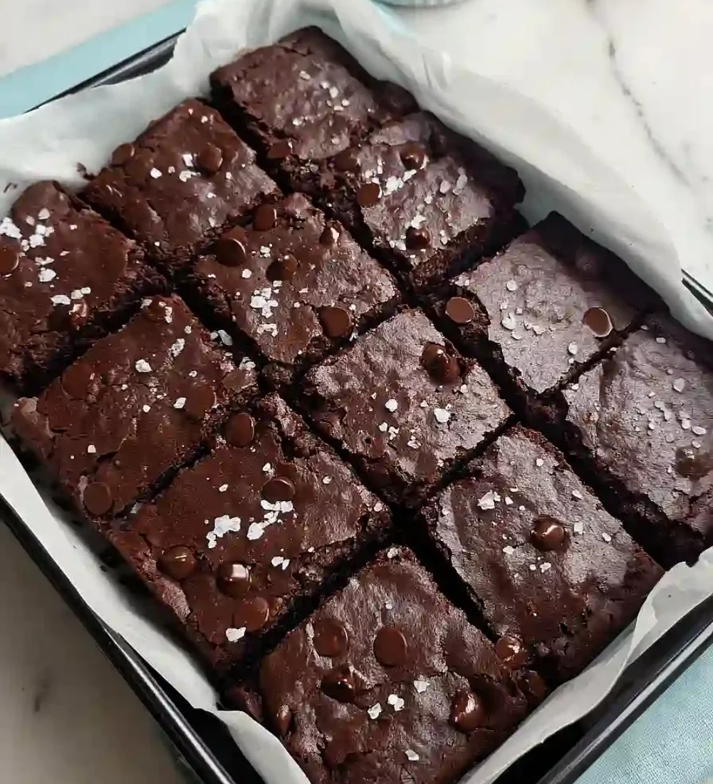 High protein Greek yogurt brownies deliciously topped and ready to enjoy