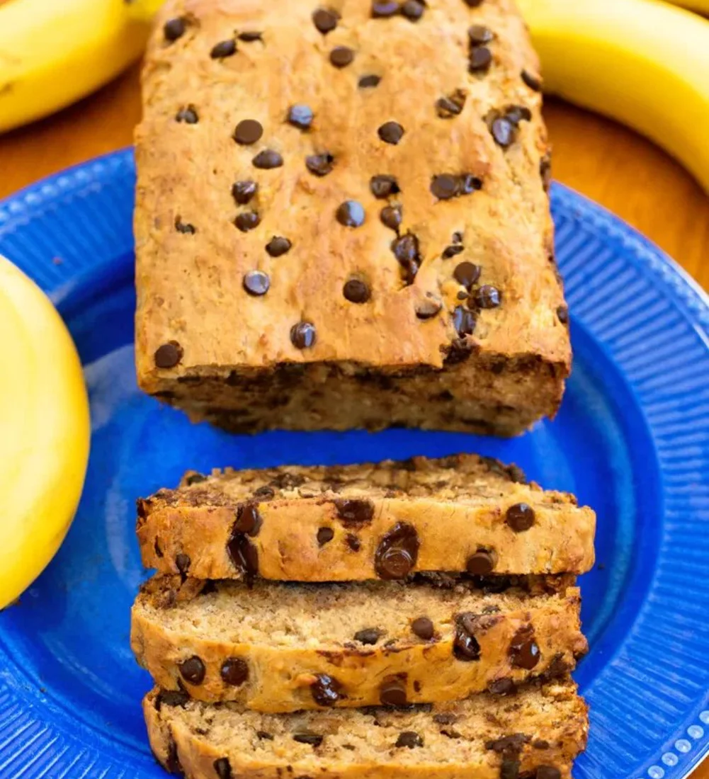 Delicious homemade protein banana bread slice on a wooden cutting board