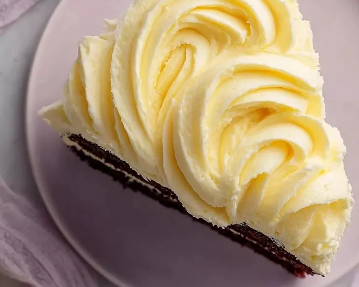 Whipped Banana Pudding Frosting on a slice of banana cake