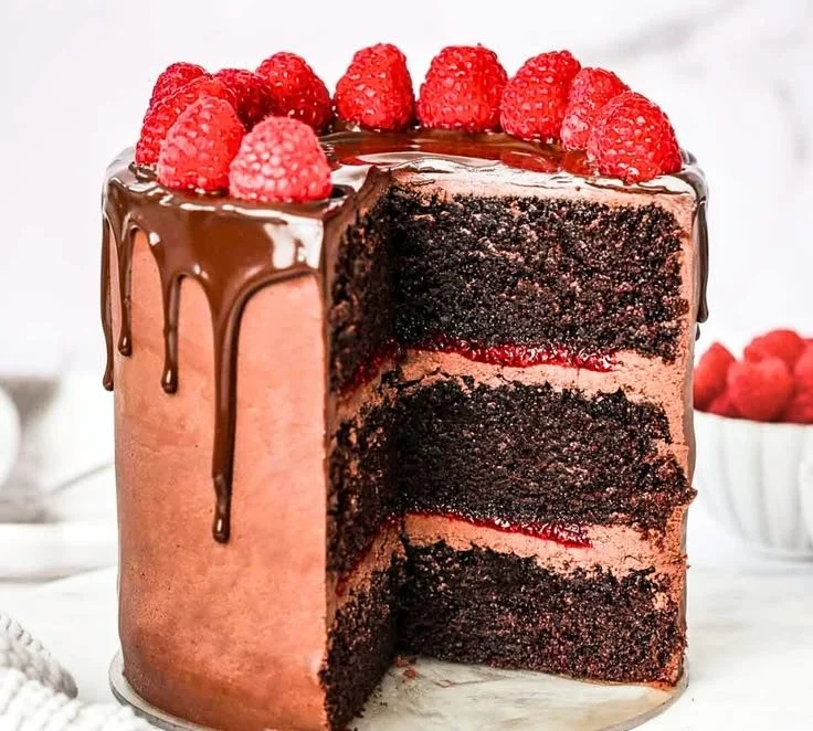 Delicious Chocolate Raspberry Layer Cake with rich layers and fresh raspberries