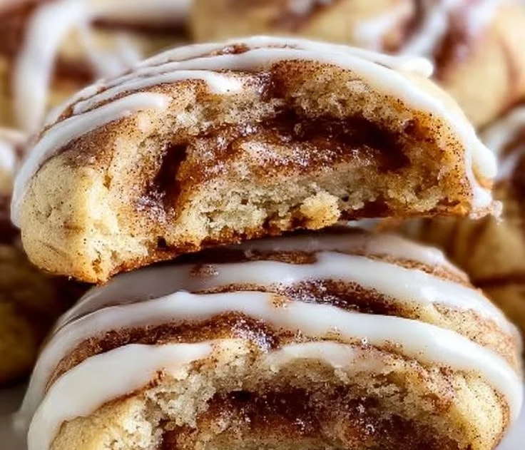 Cinnamon roll cookies filled with cinnamon and icing on a plate