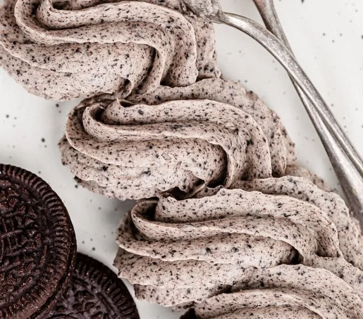 Delicious cookies and cream frosting on a chocolate cupcake