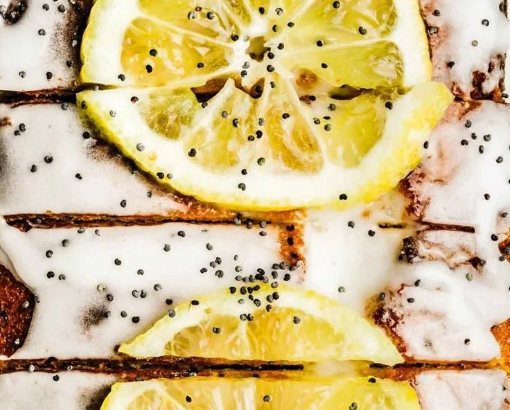 Delicious easy lemon poppy seed cake topped with lemon glaze and poppy seeds