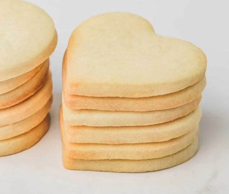 Delicious easy sugar cookies ready to enjoy on a plate.