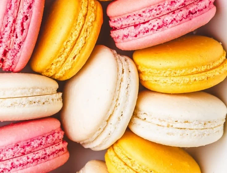 Assorted colorful French Macarons displayed artfully on a plate
