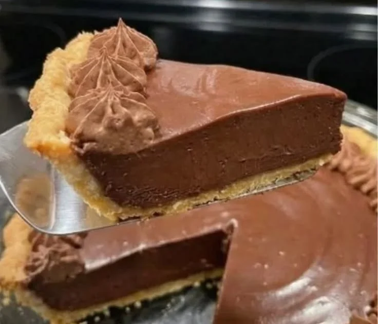 Slice of Grandma's Chocolate Pie with a rich chocolate filling and flaky crust.