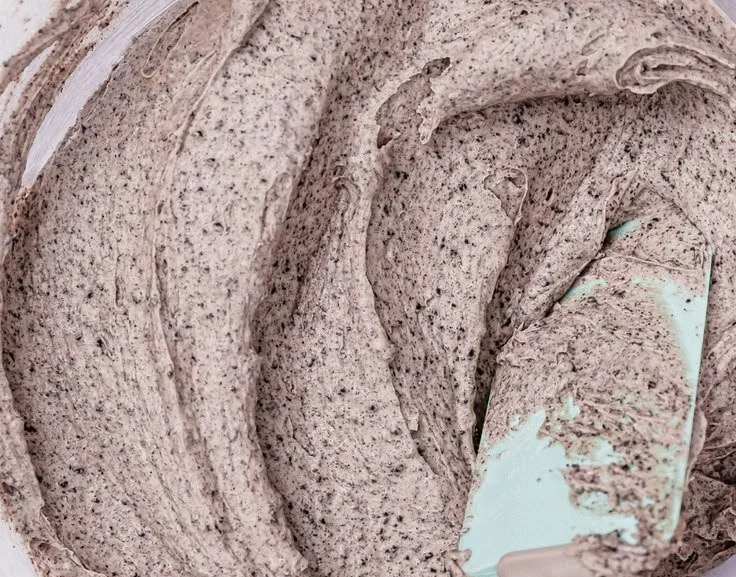 Delicious Oreo Frosting spread on a chocolate cupcake