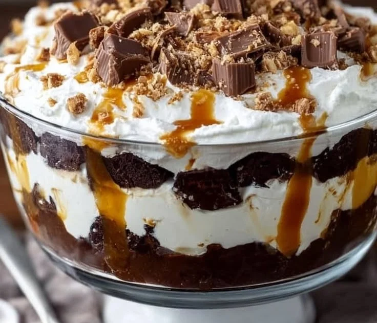 Scoop of Heaven Trifle dessert with layers of cream, fruit, and cake
