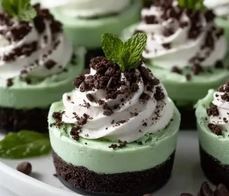 St. Patrick's Mint Cheesecake Cups served in decorative cups for a festive look