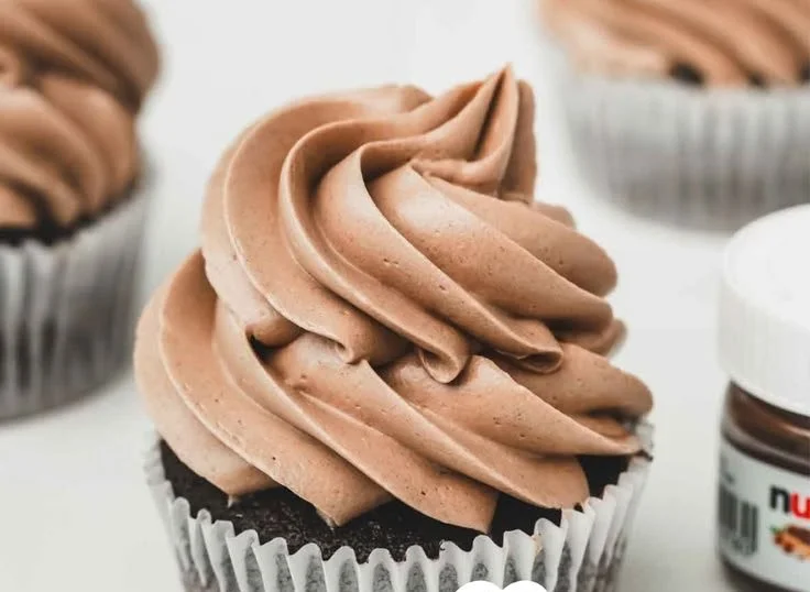 A beautifully decorated cake topped with rich Swiss Buttercream frosting.