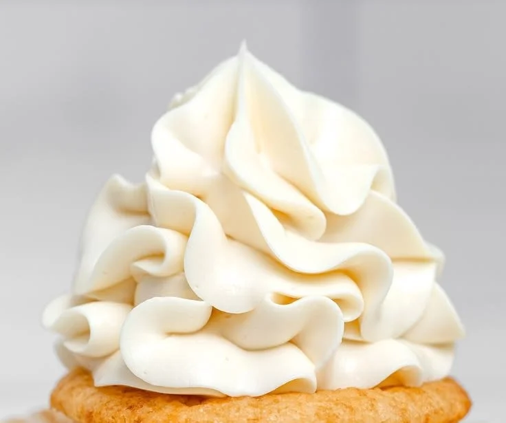 Vanilla Swiss Meringue Buttercream spread on a cake
